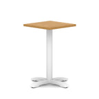 Square table with wood-effect top and white metal base on a white background