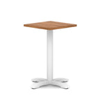 Square table with wood-effect top and white metal base on a white background