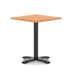 Square table with grey wood-effect top and black metal base on a white background