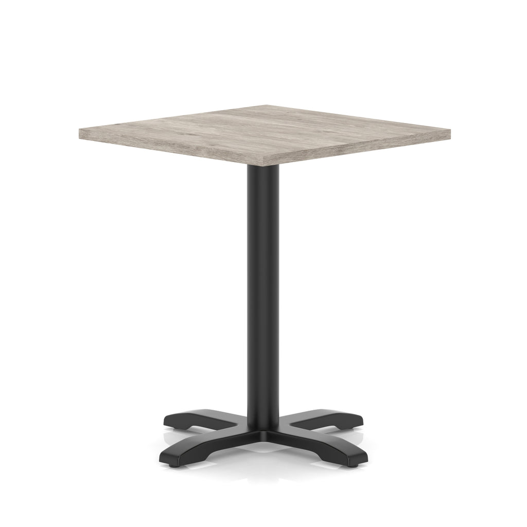 Square table with grey wood-effect top and black metal base on a white background