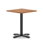 Square table with wood-effect top and black metal base on a white background