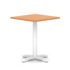 Square table with wood-effect top and white metal base on a white background