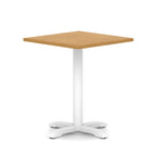 Square table with wood-effect top and white metal base on a white background