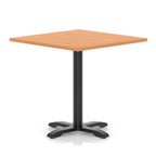 Square table with grey wood-effect top and black metal base on a white background