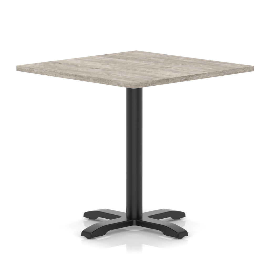 Square table with grey wood-effect top and black metal base on a white background