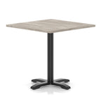 Square table with grey wood-effect top and black metal base on a white background