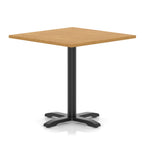 Square table with wood-effect top and black metal base on a white background
