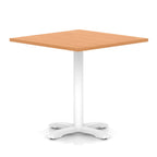 Square table with wood-effect top and white metal base on a white background