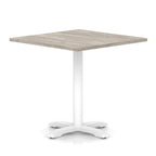 Square table with grey wood-effect top and white metal base on a white background