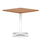 Square table with wood-effect top and white metal base on a white background
