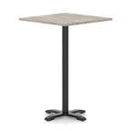 Square high table with grey wood-effect top and black metal base on a white background