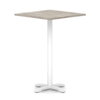Square high table with grey wood-effect top and white metal base on a white background