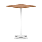 Square high table with wood-effect top and white metal base on a white background