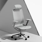 A modern grey ergonomic office chair with a headrest, adjustable armrests, and a five-wheel base, shown on a clean white surface with a geometric background.