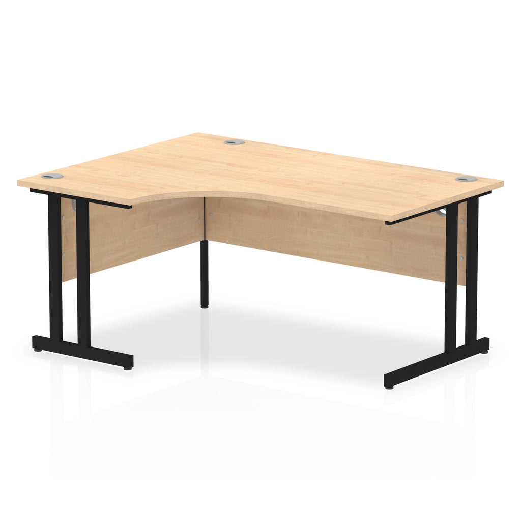  L-shaped desk with wood-effect top and metal legs on a white background