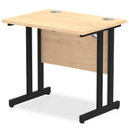 Wood-effect desk with cantilever metal legs on a white background