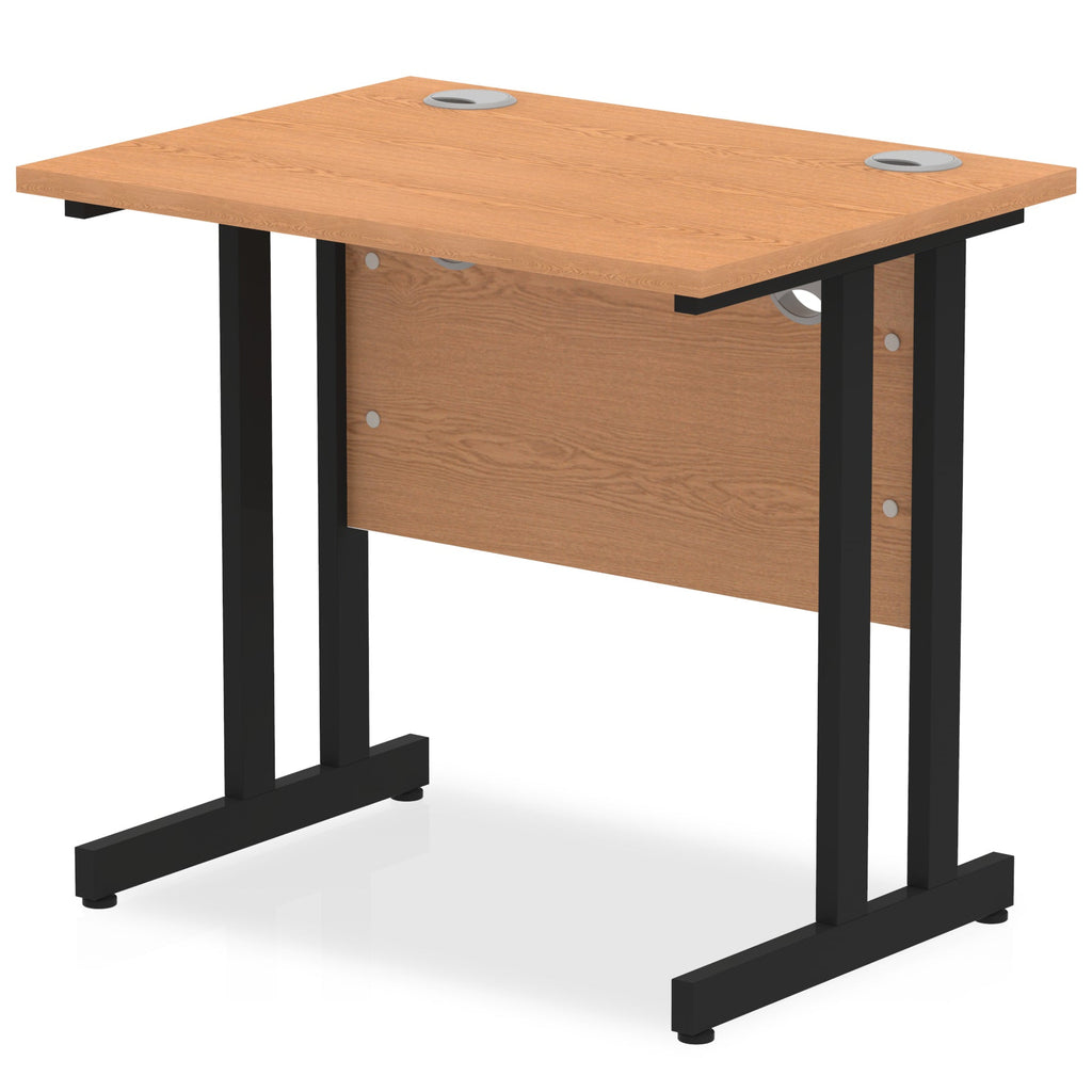 Wood-effect desk with cantilever metal legs on a white background