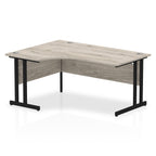  L-shaped desk with wood-effect top and metal legs on a white background