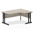Wood-effect L-shaped desk with metal legs on a white background