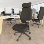 Black office chairs next to desks with computers on the wooden floor