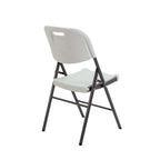 White folding chair with black metal frame on a white background