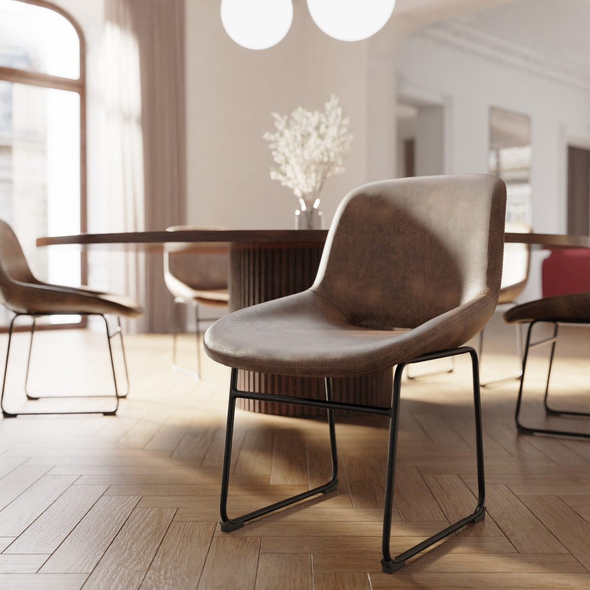 Modern brown chair in a stylish interior setting with a table and decor.