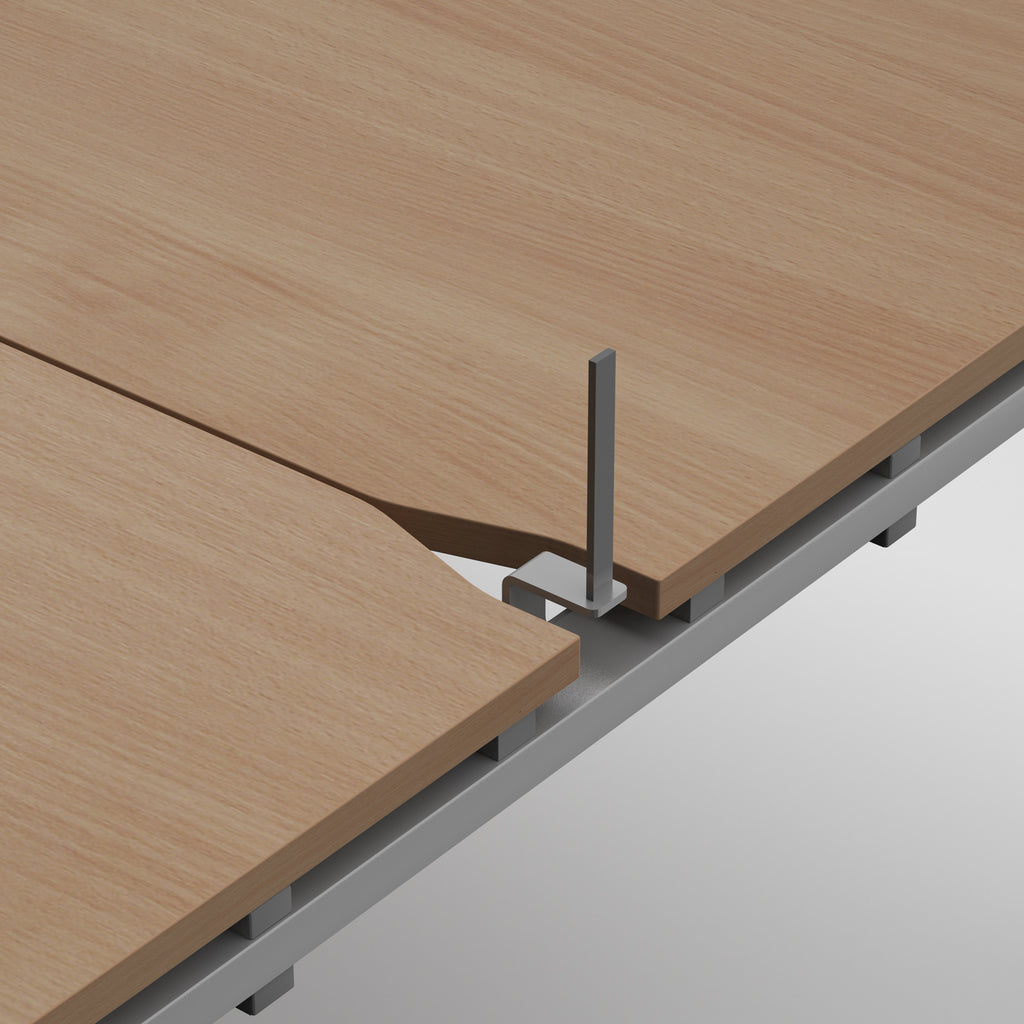 Close-up of a light oak wood tabletop with a metal support bracket and frame structure, shown on a clean light grey background.