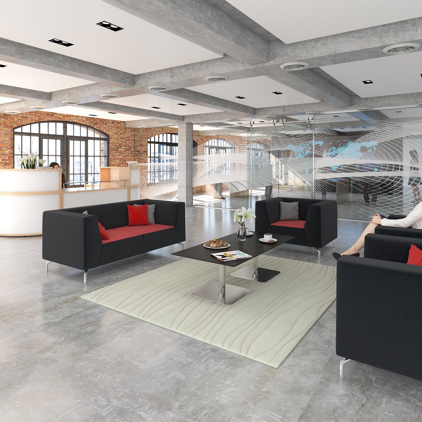 Modern office lobby furniture set including black fabric sofas with red accent pillows, a black coffee table, a cream textured area rug, and a reception desk in the background.