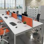 Modern office setup with desks, chairs, and computer equipment.