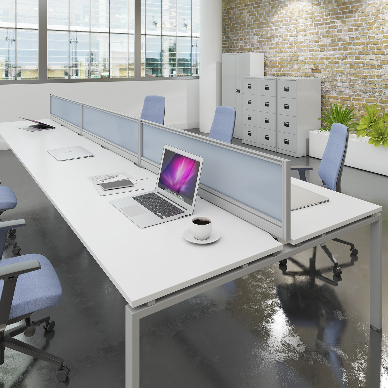 Modern office setup with long white desk, chairs, and computer equipment.