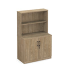Office hutch cabinet in walnut wood grain finish with two doors, black handles, and an open upper shelf section, shown on a plain white background.