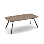 A modern rectangular table with a rounded-rectangular wood-grain top and four angled black metal legs, shown on a clean white background.