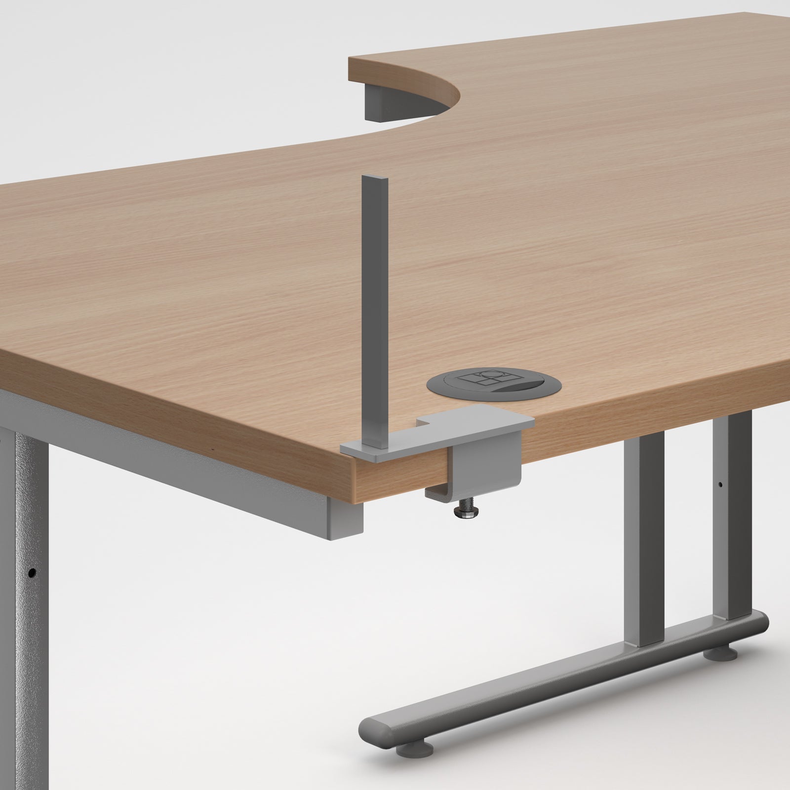 A close-up of a modern desk showing a light wood grain desktop with a curved cut-out, a grey metal support post, a cable management grommet, and a grey metal leg frame on a light grey background.