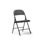 A folding chair with a black frame and a textured grey backrest and seat, set against a plain white background.