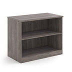 A two-tier bookcase with a grey wood-effect finish, shown from a three-quarter angle on a solid white background.