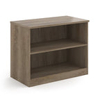 A two-tier bookcase with a wood-effect finish, shown from a three-quarter angle on a solid white background.