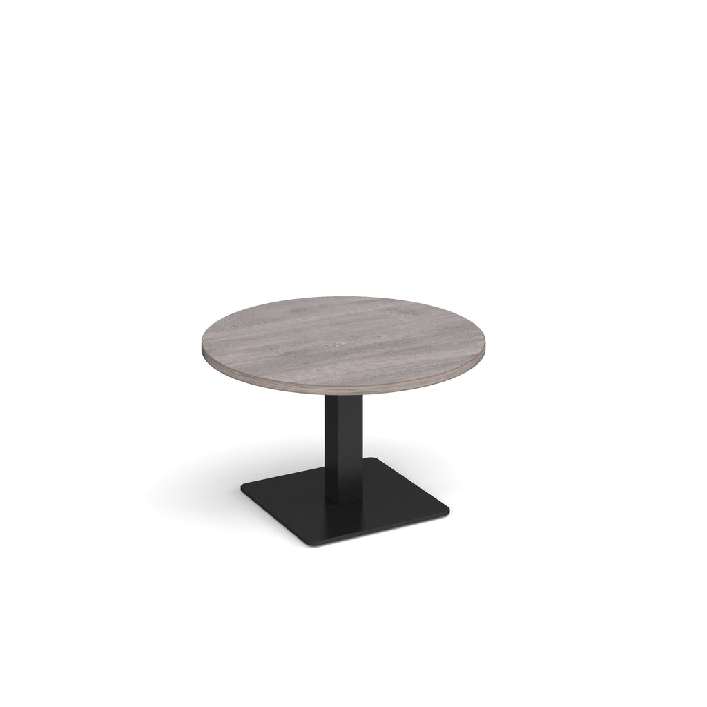 A modern round coffee table with a grey wood-effect top and a square black pedestal base, shown on a plain white background.
