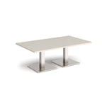 Rectangular coffee table with light grey top and two brushed steel metal square bases, shown on a white background