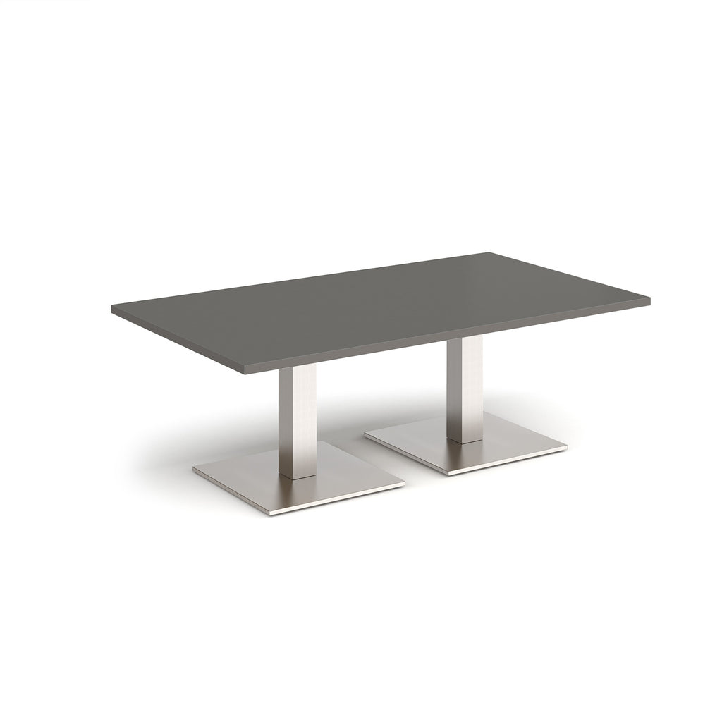 Rectangular coffee table with grey top and two brushed steel metal square bases, shown on a white background