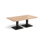 Rectangular coffee table with wood-effect top and two black metal square bases, shown on a white background