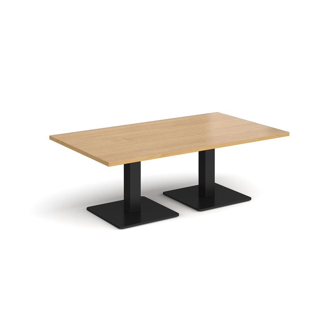 Rectangular coffee table with wood-effect top and two black metal square bases, shown on a white background