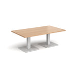 Rectangular coffee table with wood-effect top and two white metal square bases, shown on a white background
