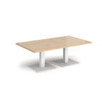 Rectangular coffee table with wood-effect top and two white metal square bases, shown on a white background