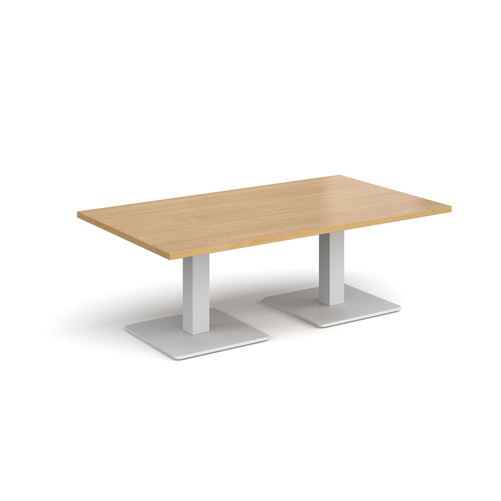 Rectangular coffee table with wood-effect top and two white metal square bases, shown on a white background