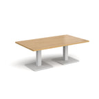 Rectangular coffee table with wood-effect top and two white metal square bases, shown on a white background