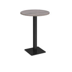 Round poseur table with grey wood-effect top and black metal base, shown on a white background