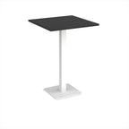 Square poseur table with black top and white metal base on a white background