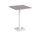 Square poseur table with grey wood-effect top and white metal base on a white background