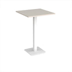 Square poseur table with light grey top and white metal base on a white background