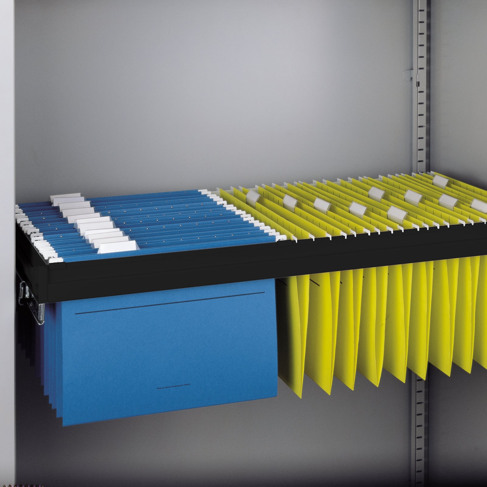 Storage system with blue and yellow files in a grey cupboard